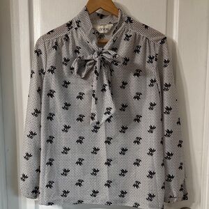 Elegant Black and White Patterned Blouse with Bow